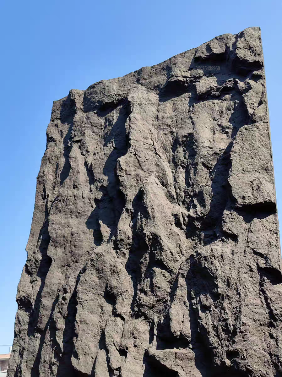 Large stone sculpture against a clear blue sky